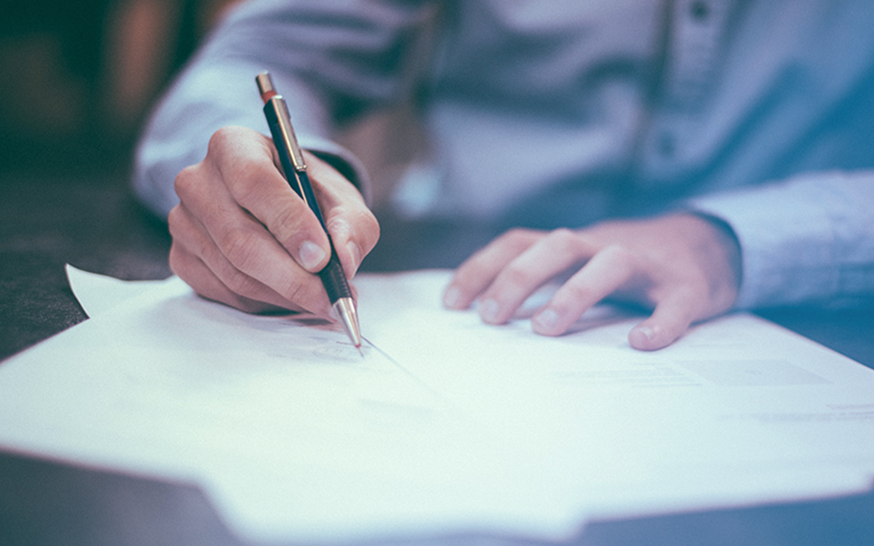 Image of a businessman reviewing reports - representing how Mier Human Capital can help businesses achieve their new hire goals