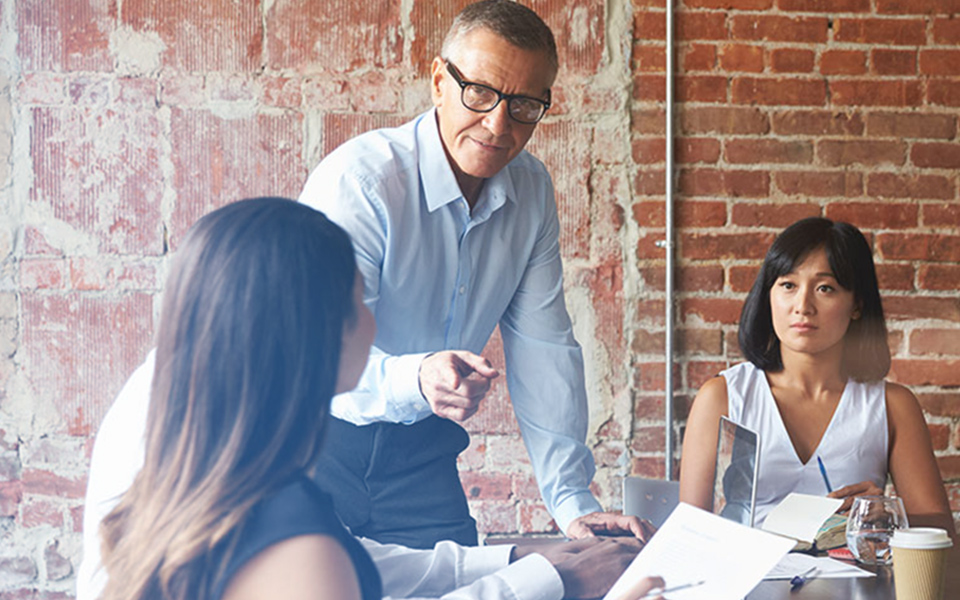 Image of three business people brainstorming new concepts - representing how Mier Human Capital came to be and how they help other businesses